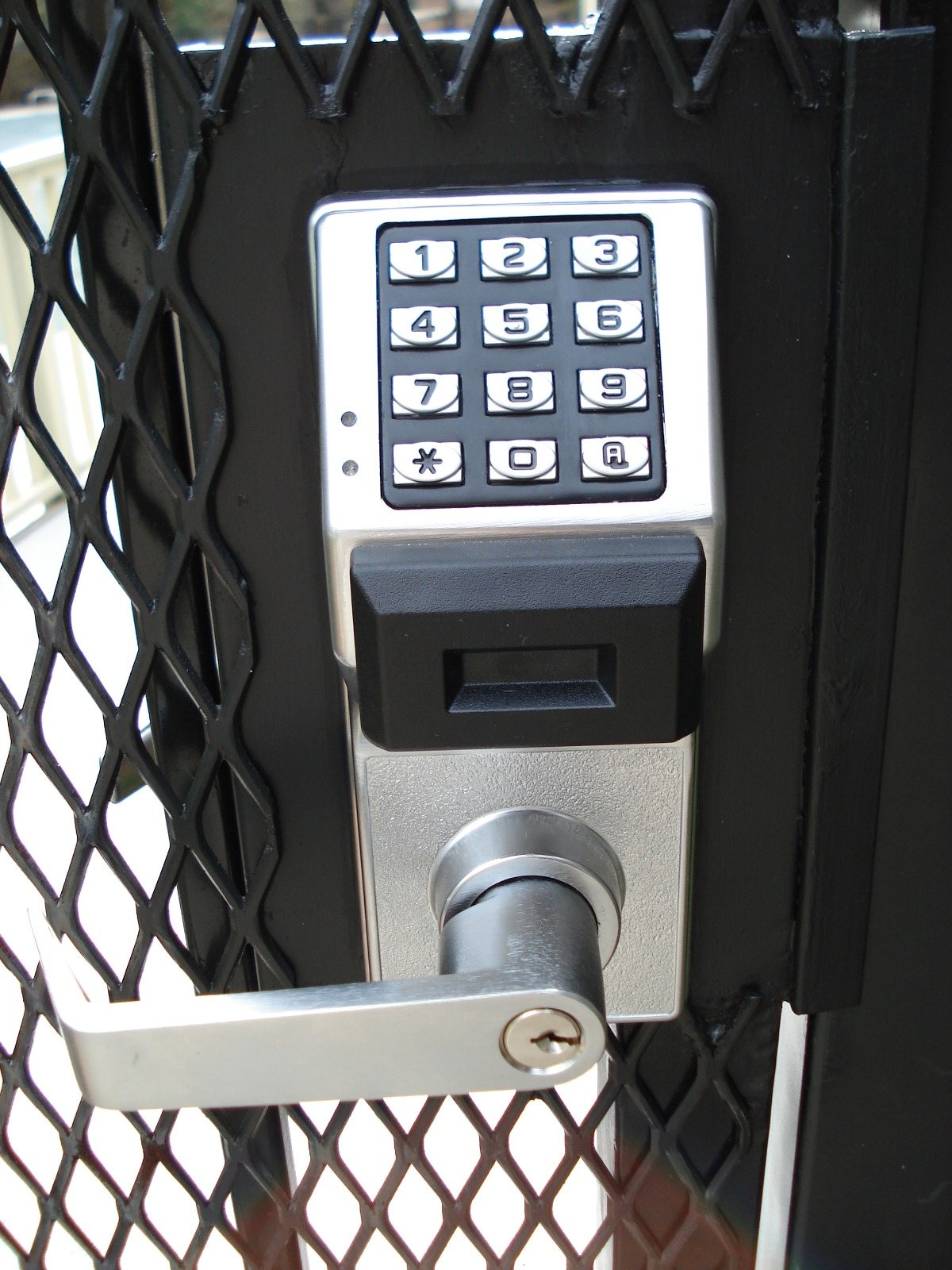Keypad and prox reader lever lock on a secured gate