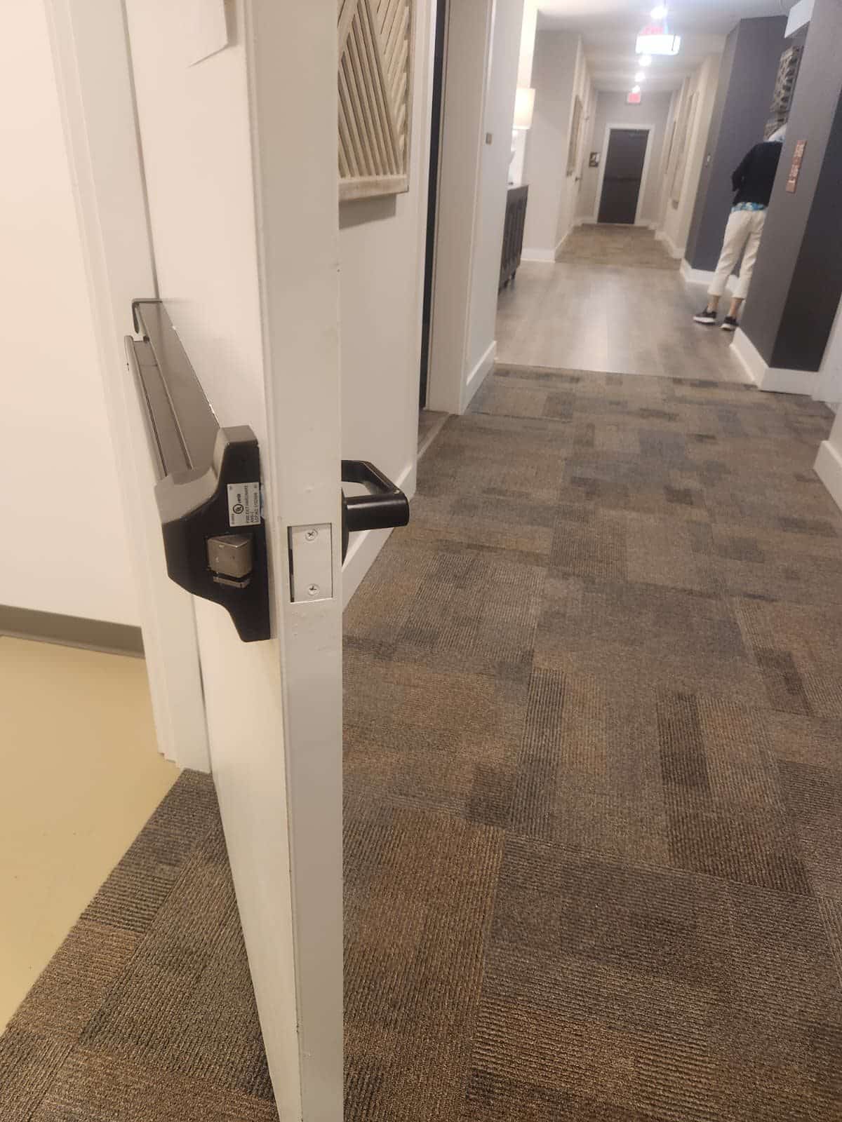Exit device installed on a commercial corridor door