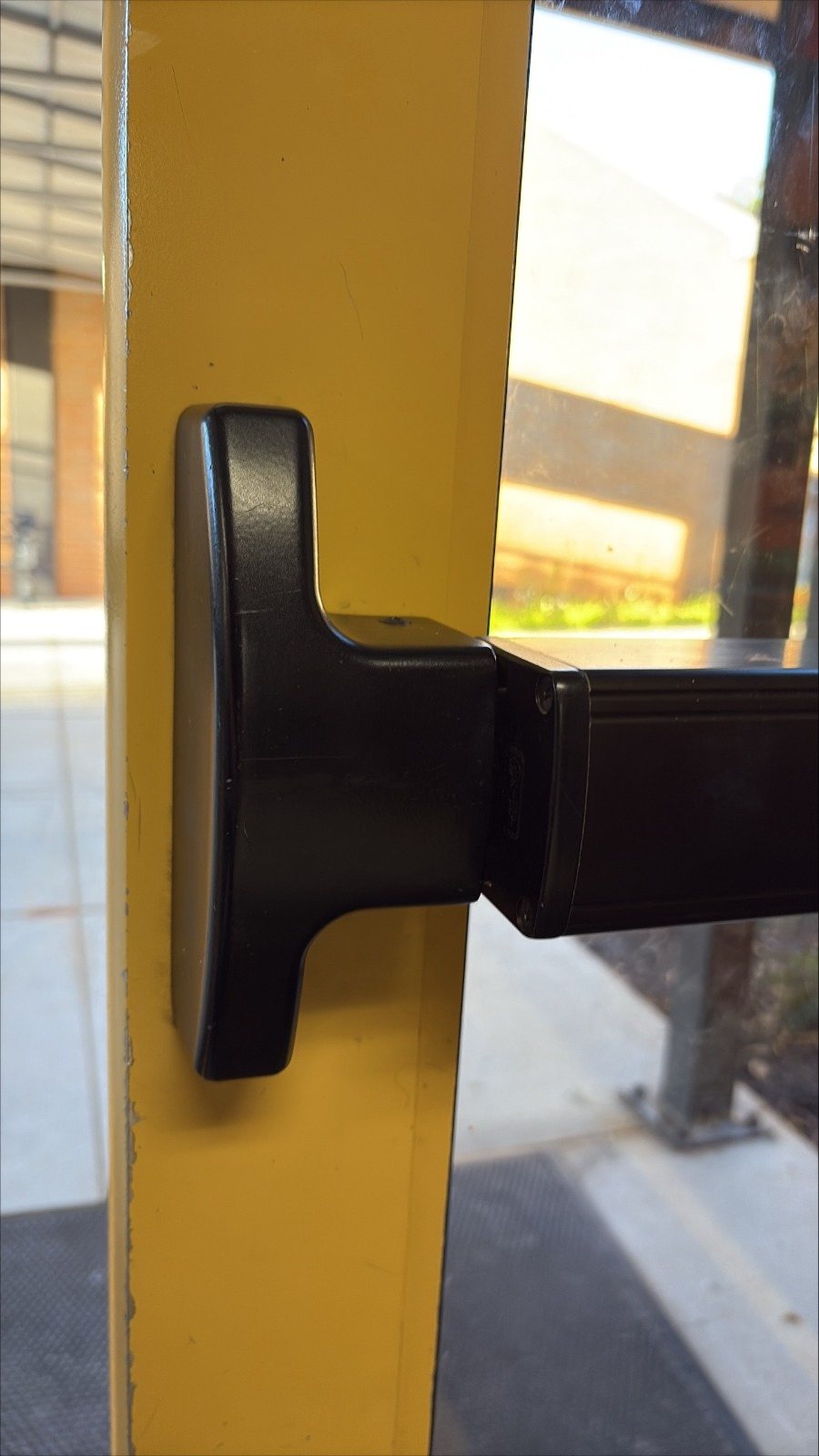 Panic bar exit device on a commercial door