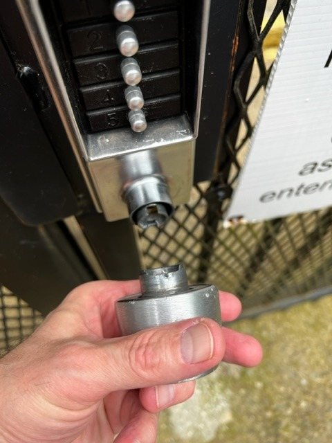 Gate lock being serviced at an apartment community