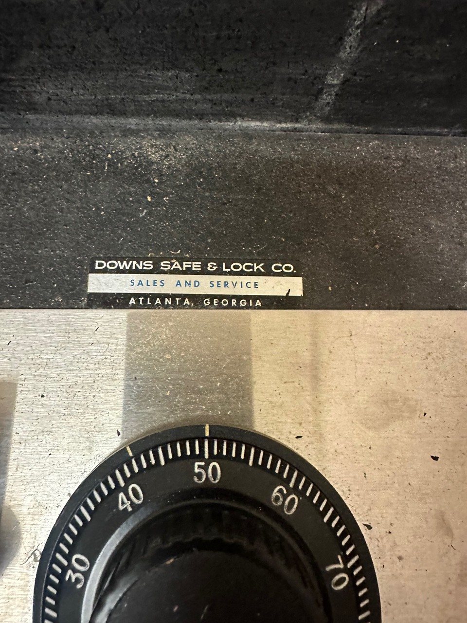 Safe combination dial with a Downs Safe & Lock plate